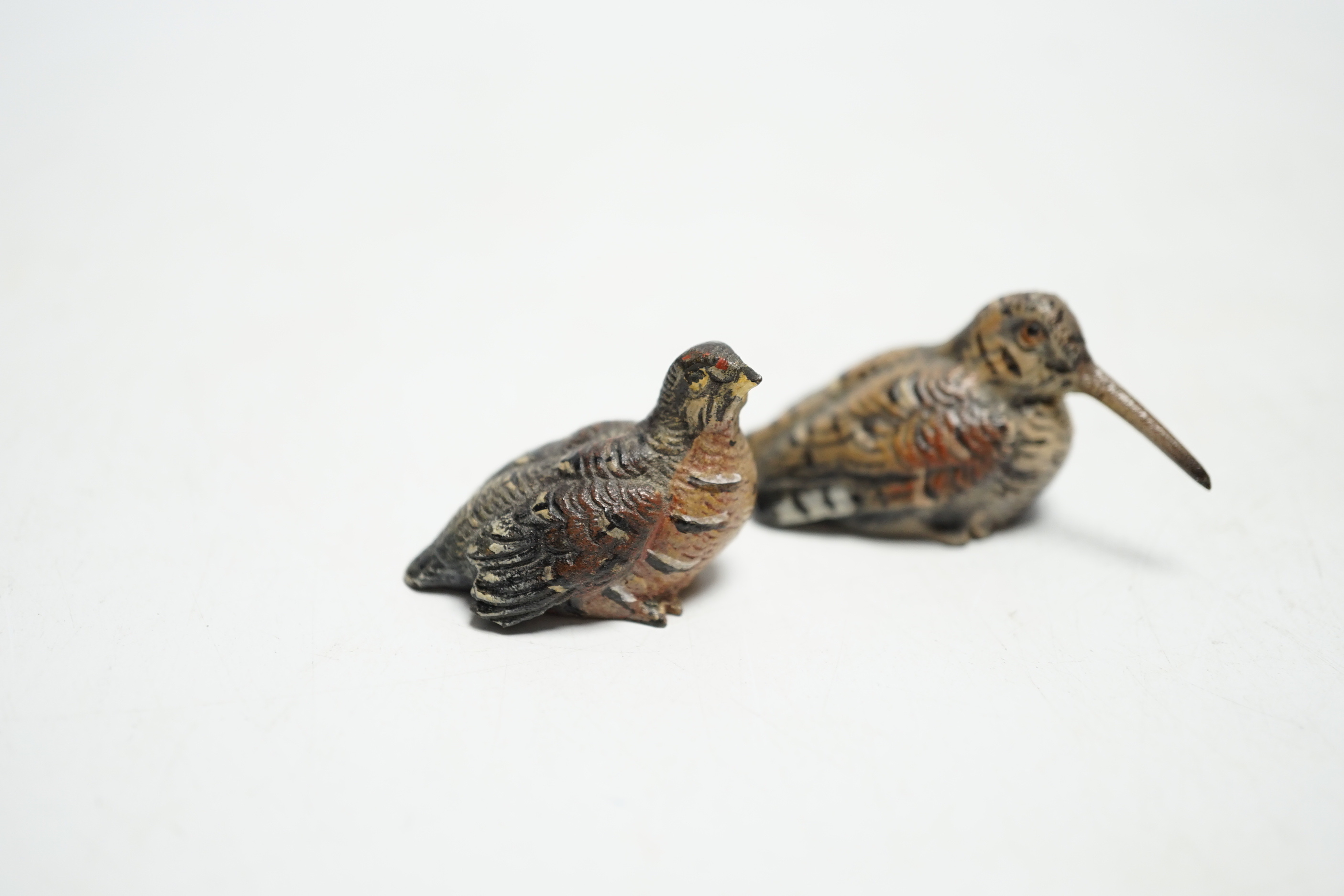 Two miniature Austrian cold painted bronze models of a snipe and partridge, longest 5cm